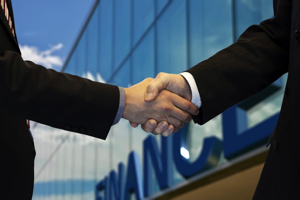 shaking hands, company, office-5217122.jpg